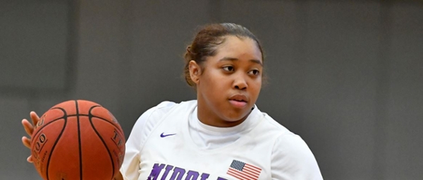 Knights women's basketball player dribbling the ball during a game. 